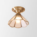 Minimalist single ceiling lamp in wavy metal, semi flush mount in brass