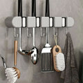 Support mural polyvalent pour outils domestiques