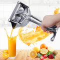 Prensa manual para frutas | Exprimidor de acero inoxidable | Mango antideslizante | PureSqueeze