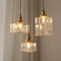 Lampade vintage appese in vetro con finitura in ottone