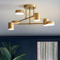 Six-light ceiling fixture with brass finish and cylindrical lampshades