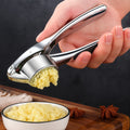 Prensa de ajo de acero inoxidable minimalista con mango antideslizante