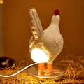 Lampe de table en forme de poulet avec lumière LED intégrée et base stable